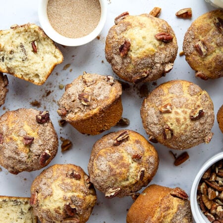 Crunchy pecans and lots of cinnamon sugar are the perfect muffin combo in these soft and fluffy pecan snickerdoodle muffins.
