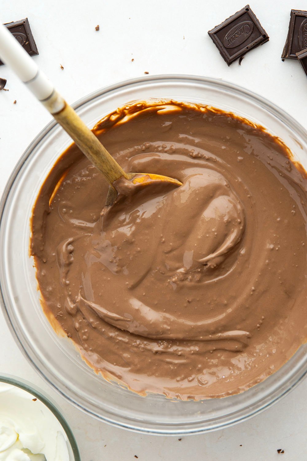 Rich and silky homemade chocolate pudding is easy to make from scratch and incredible with a scoop of fresh whipped cream and chocolate shavings on top.