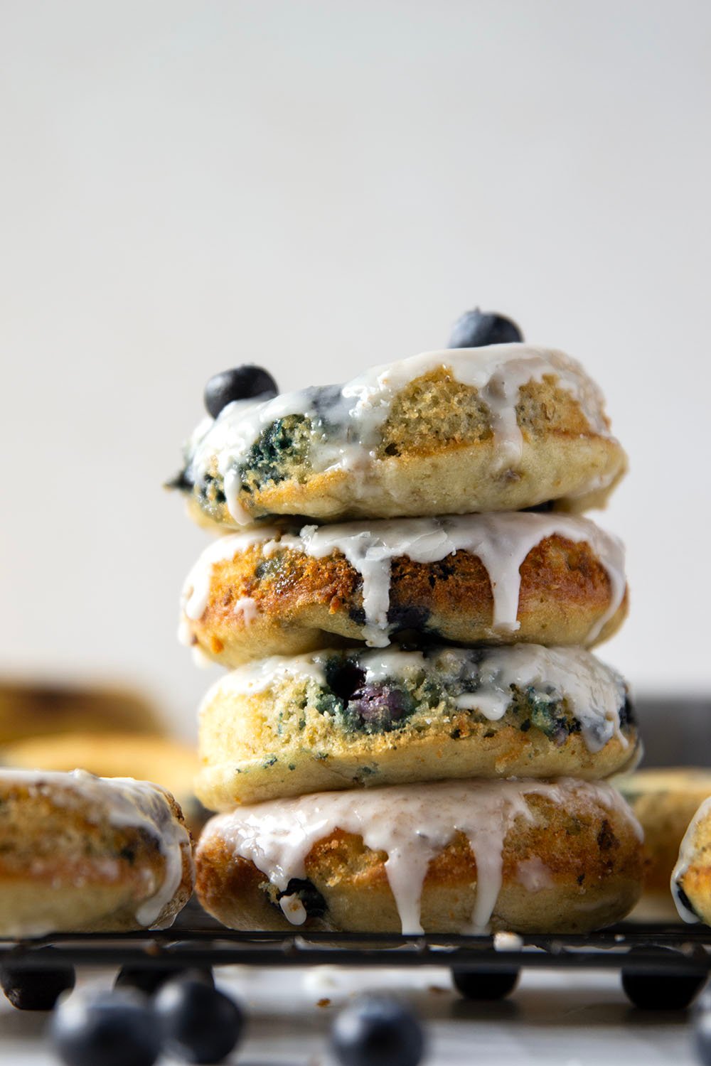 These blueberry banana donuts are incredibly moist inside, studded with juicy blueberries, and dipped in lots of creamy vanilla glaze.