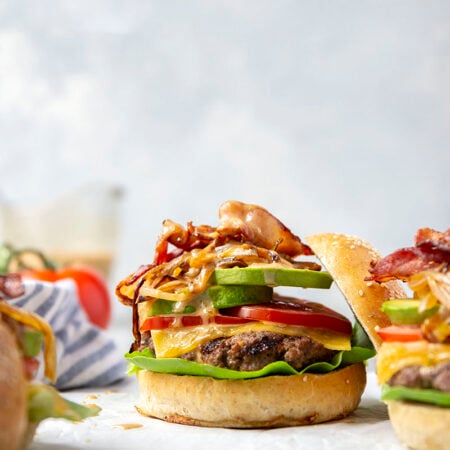 These cowboy burgers are loaded with all the works! Flavorful caramelized onions, silky avocado, crisp bacon, and an incredible homemade special sauce take them over the top.