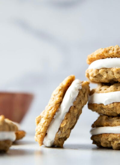 These homemade oatmeal cream pies feature soft and chewy oatmeal cookies with a fluffy marshmallow cream filling. Better than Little Debbie's any day!