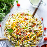 This BLT macaroni salad is packed with crispy bacon, shredded lettuce, juicy tomatoes, lots of shredded cheddar, and tossed in a perfectly creamy homemade herb ranch dressing.