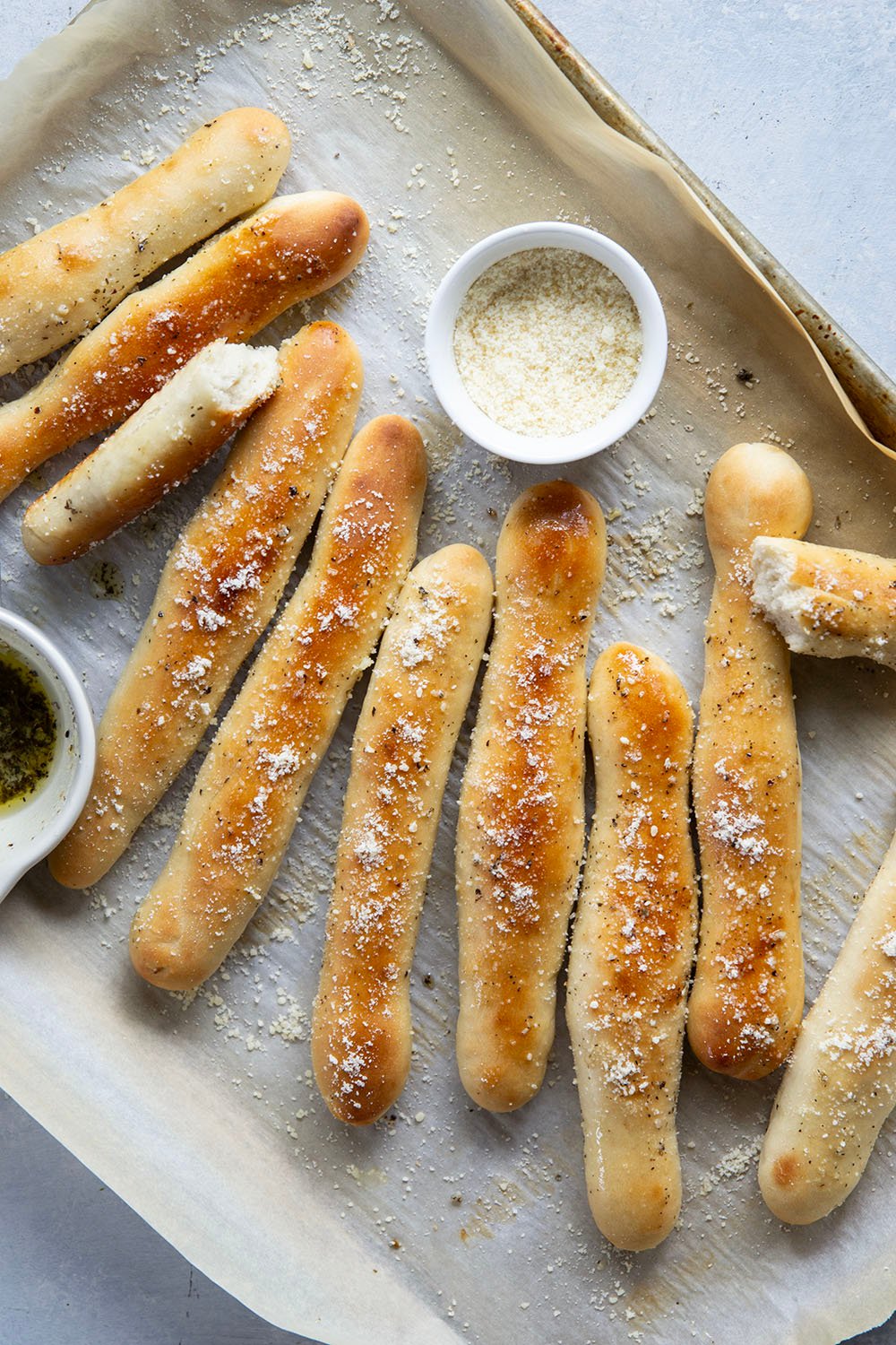 Learn how to make perfect homemade breadsticks with this easy recipe! Soft on the inside, crusty on the outside, and brushed in a garlic herb butter.