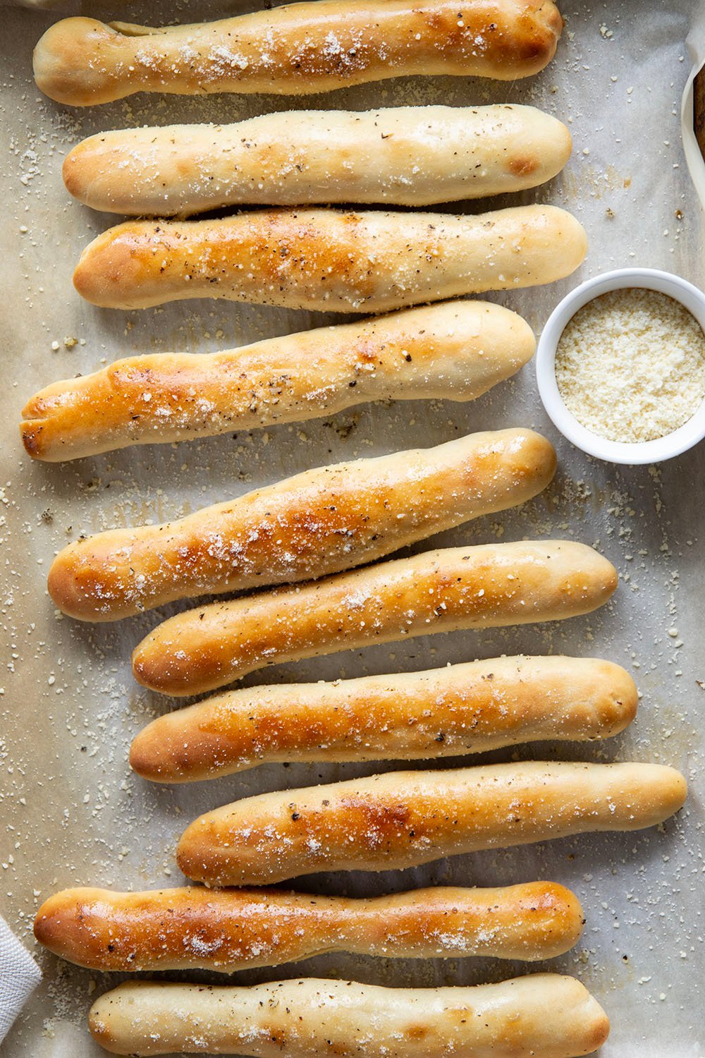 Learn how to make perfect homemade breadsticks with this easy recipe! Soft on the inside, crusty on the outside, and brushed in a garlic herb butter.