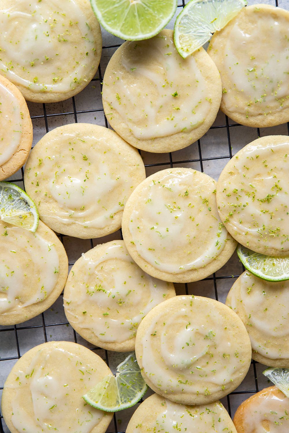 Soft, cake-like tea cakes are topped with a rich lime cream cheese glaze for the best little dessert or snack bite!