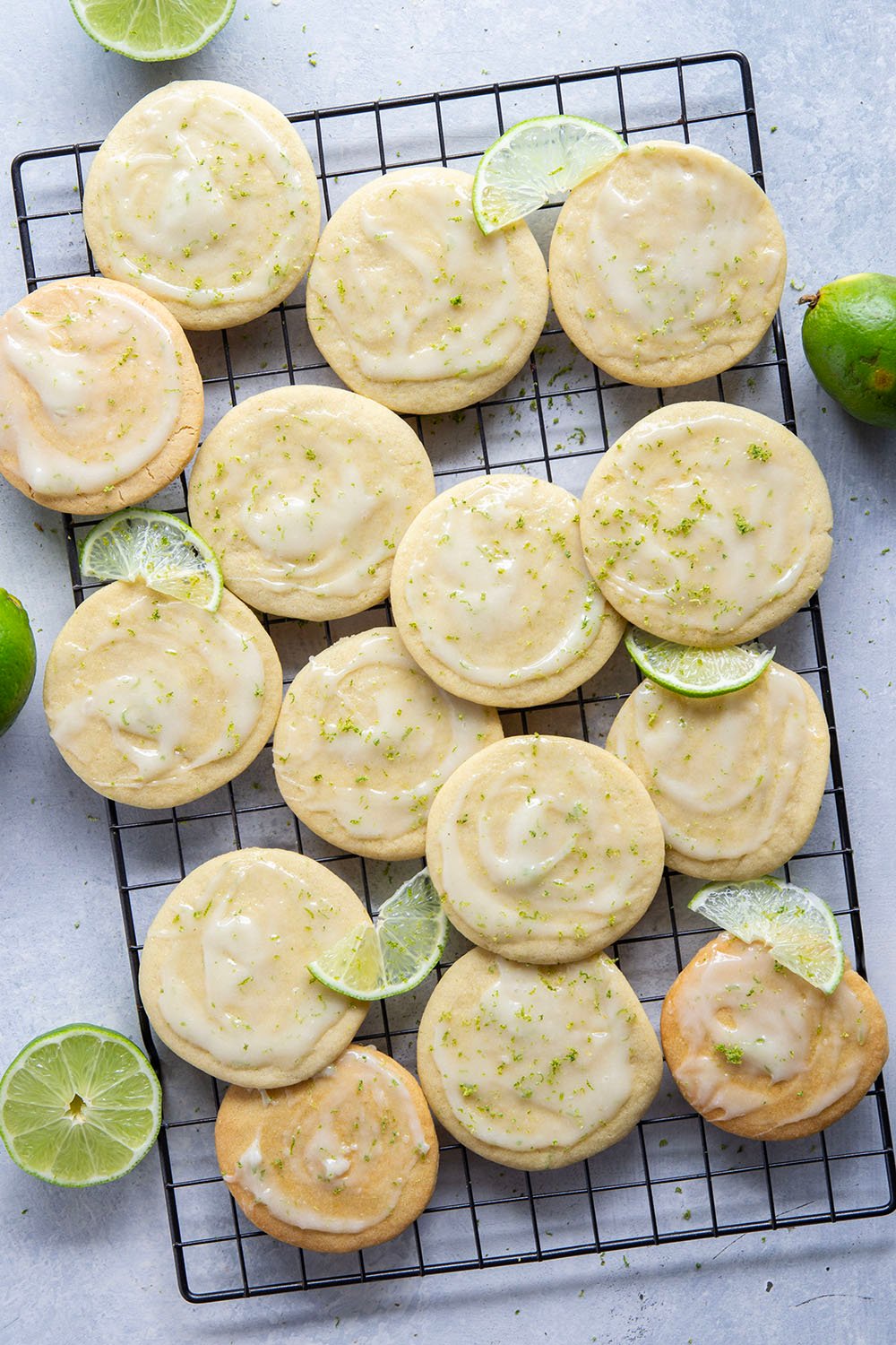 Soft, cake-like tea cakes are topped with a rich lime cream cheese glaze for the best little dessert or snack bite!