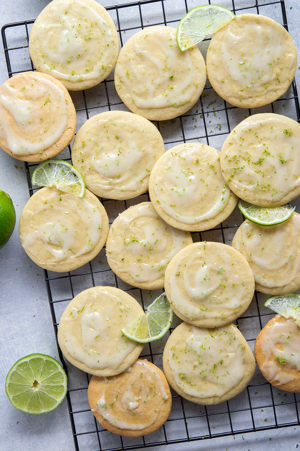 Soft, cake-like tea cakes are topped with a rich lime cream cheese glaze for the best little dessert or snack bite!