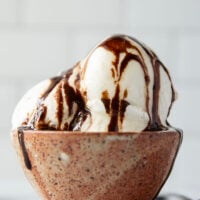 Smooth and creamy homemade vanilla ice cream that tastes better than any store-bought brand and only needs 4 basic ingredients! Load up this easy ice cream with all your favorite ice cream toppings.