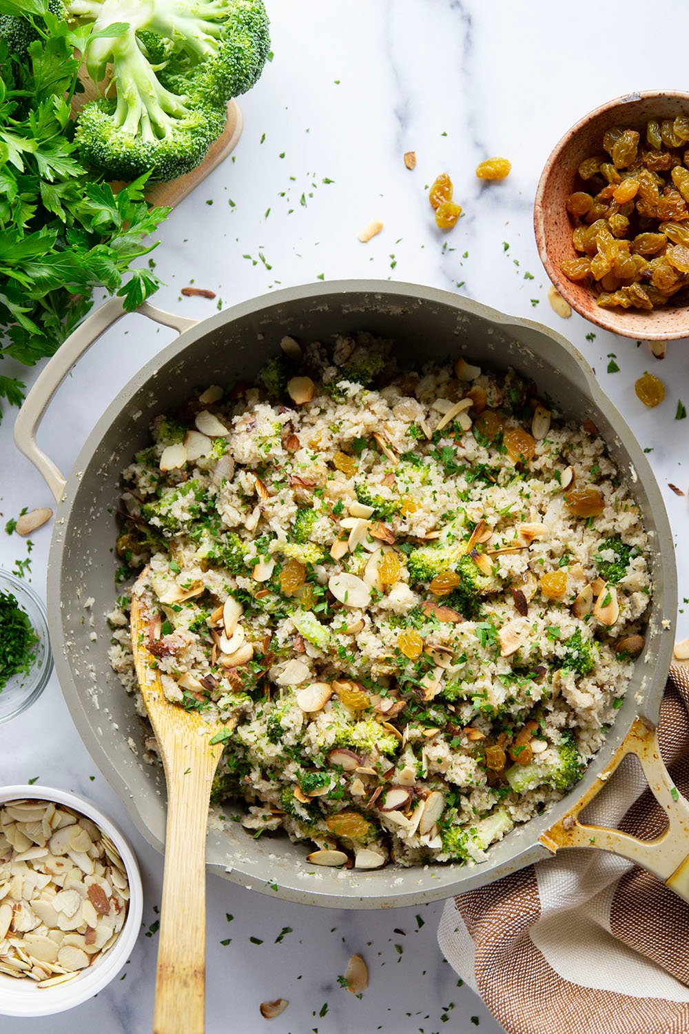 You won't believe that the base for this cauliflower rice pilaf is made entirely from riced cauliflower! It's unbelievably fluffy and jam-packed with tender broccoli, crunchy almonds and soft golden raisins.