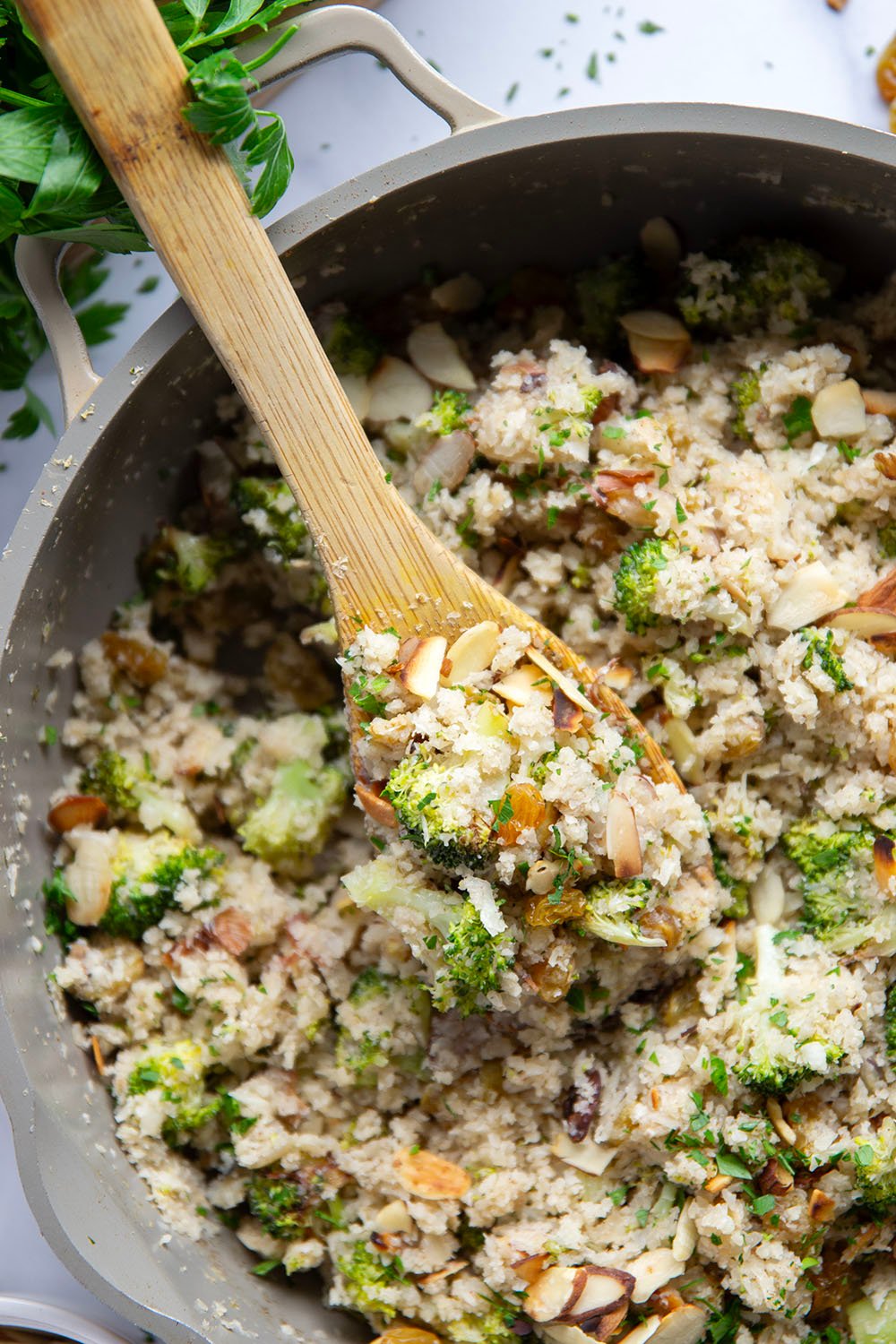 You won't believe that the base for this cauliflower rice pilaf is made entirely from riced cauliflower! It's unbelievably fluffy and jam-packed with tender broccoli, crunchy almonds and soft golden raisins.