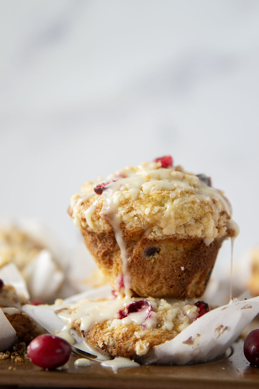 Loaded with tart cranberries and generously topped with buttery streusel and creamy eggnog glaze, these cranberry eggnog muffins are a staple for any holiday breakfast.
