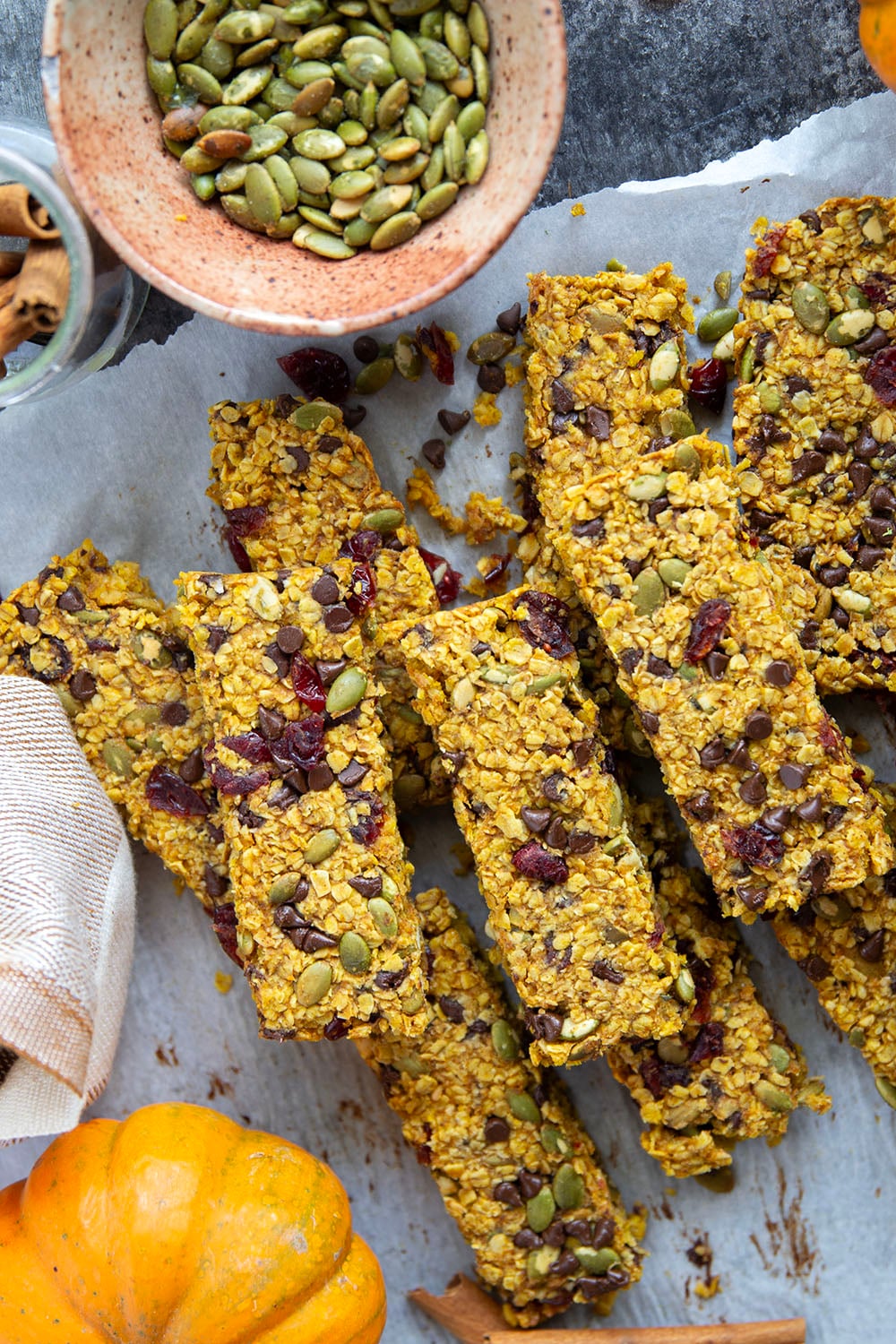 These soft and chewy pumpkin granola bars are packed with gooey chocolate, crunchy pepitas, and sweet dried cranberries. A filling grab-and-go breakfast or snack!