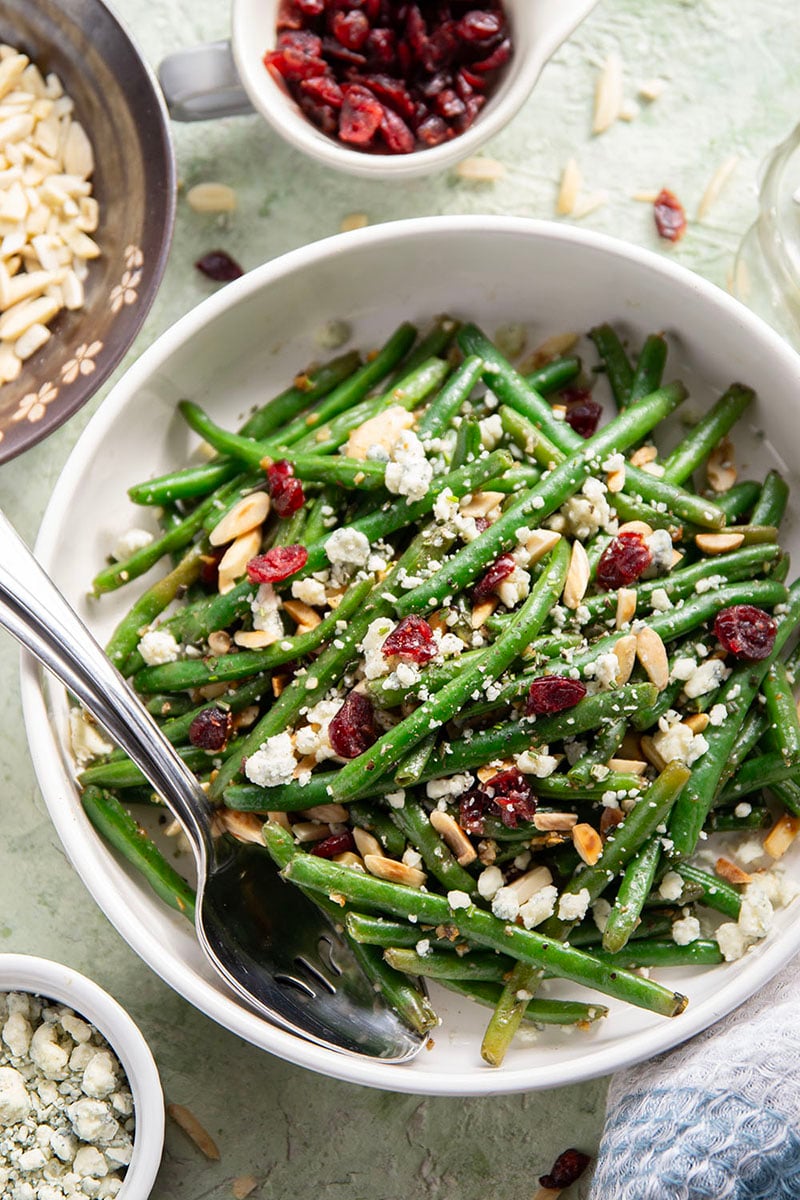 These holiday-style cranberry green beans are a breeze to throw together and combine nutty browned butter, sweet cranberries, toasted almonds, and sharp blue cheese.