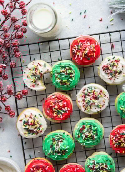 Homemade soft frosted sugar cookies have the most buttery, melt-in-your-mouth texture and are perfection topped with a creamy vanilla buttercream and lots of sprinkles.