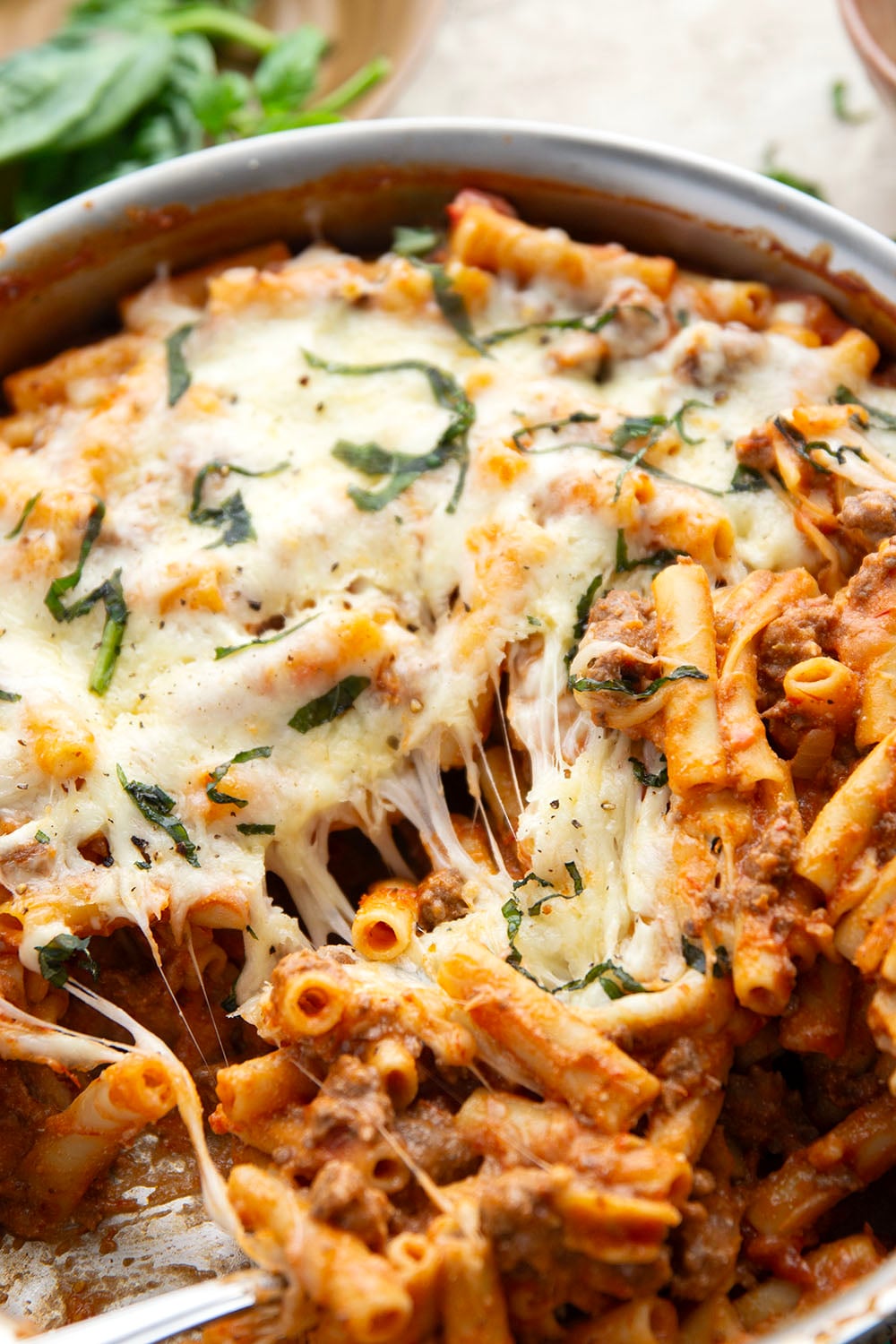 This rich and cheesy skillet baked ziti cooks up entirely in one skillet and you can throw it together in only 30 minutes!