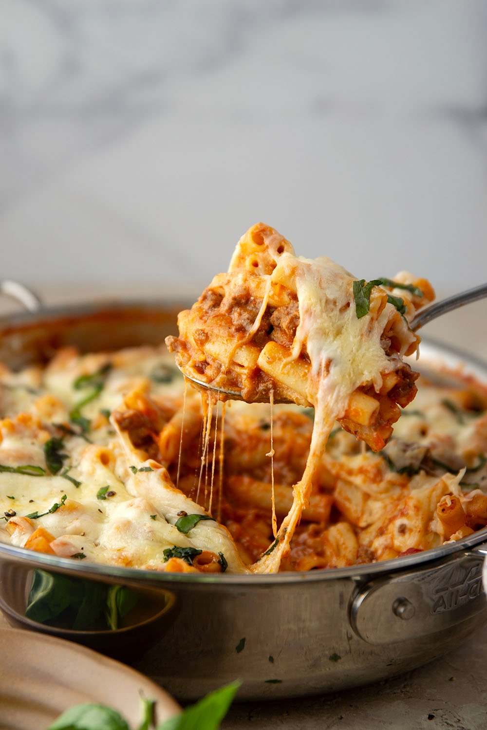 This rich and cheesy skillet baked ziti cooks up entirely in one skillet and you can throw it together in only 30 minutes!