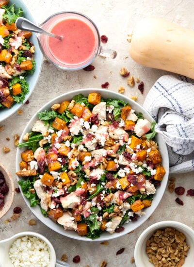 This hearty butternut squash kale salad includes leftover turkey, spice-roasted butternut squash, a tangy cranberry vinaigrette, and lots of other goodness!