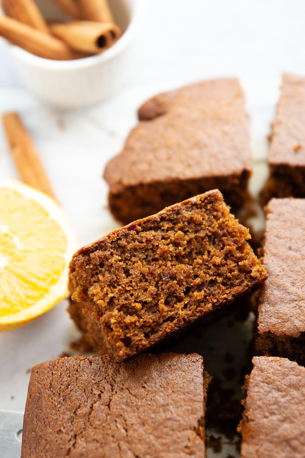 Old-fashioned gingerbread cake is a must around the holidays! This simple cake is perfectly spiced, incredibly moist, and the best Christmas dessert with a dollop of whipped cream and caramel sauce on top.