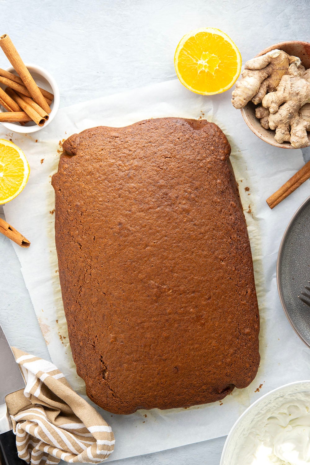 Old-fashioned gingerbread cake is a must around the holidays! This simple cake is perfectly spiced, incredibly moist, and the best Christmas dessert with a dollop of whipped cream and caramel sauce on top.