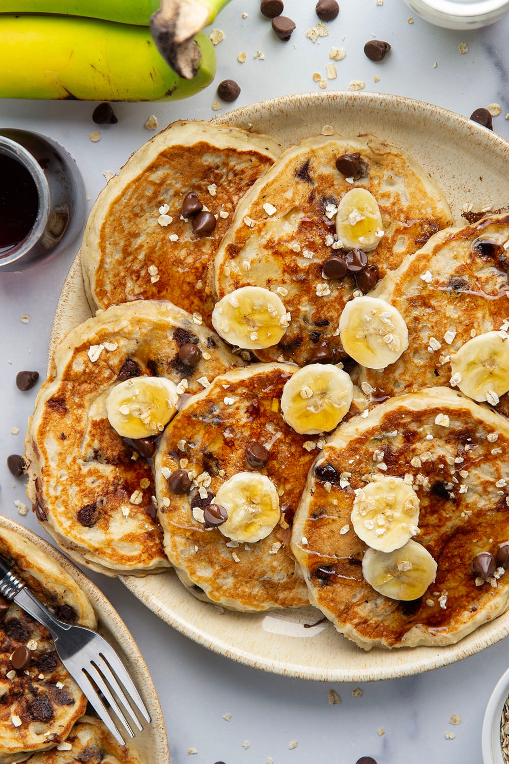 Loaded with lots of banana, hearty oats, and gooey chocolate chips, these fluffy chocolate chip oatmeal pancakes are the ultimate breakfast stack and perfect for the weekend.