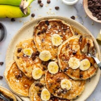 Loaded with lots of banana, hearty oats, and gooey chocolate chips, these fluffy chocolate chip oatmeal pancakes are the ultimate breakfast stack and perfect for the weekend.