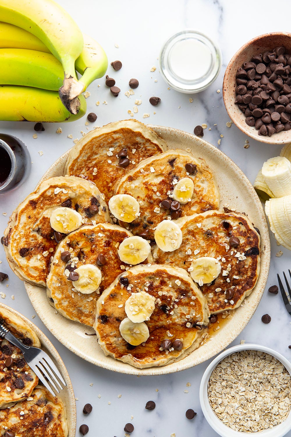 Loaded with lots of banana, hearty oats, and gooey chocolate chips, these fluffy chocolate chip oatmeal pancakes are the ultimate breakfast stack and perfect for the weekend.