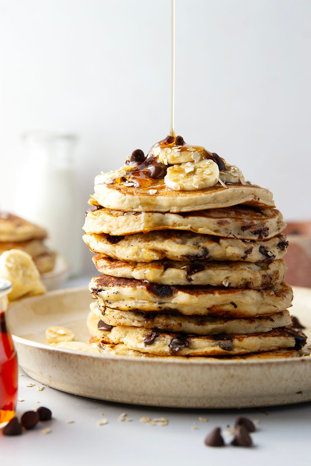 Loaded with lots of banana, hearty oats, and gooey chocolate chips, these fluffy chocolate chip oatmeal pancakes are the ultimate breakfast stack and perfect for the weekend.
