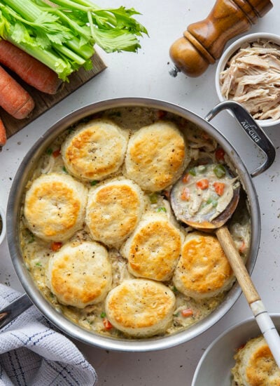 Homemade chicken pot pie just got way easier! This biscuit chicken pot pie is cooked entirely in one skillet and features flaky biscuits baked on top of a creamy chicken veggie filling.