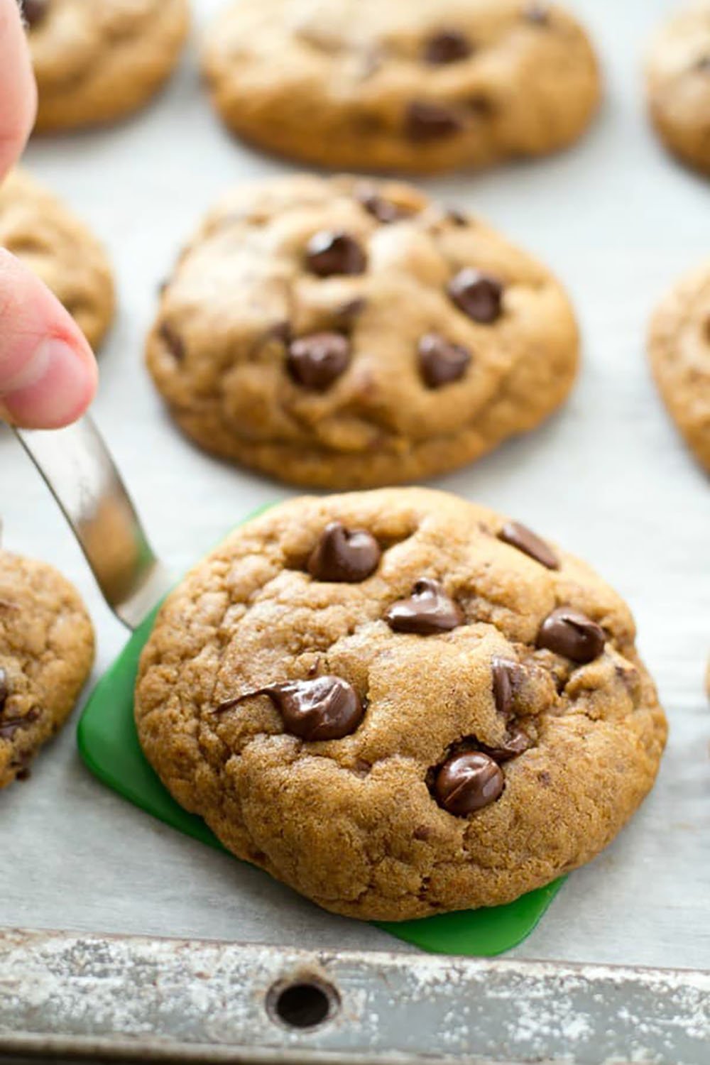 These coconut oil chocolate chip cookies are perfectly crispy on the outside and so soft and chewy inside, you'll never guess that they're made healthy with coconut oil and contain NO butter! Destined to become your new favorite chocolate chip cookie.