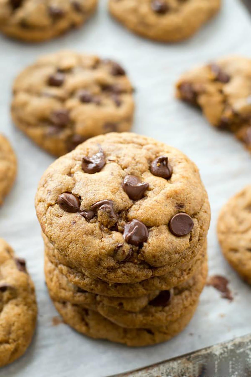These coconut oil chocolate chip cookies are perfectly crispy on the outside and so soft and chewy inside, you'll never guess that they're made healthy with coconut oil and contain NO butter! Destined to become your new favorite chocolate chip cookie.