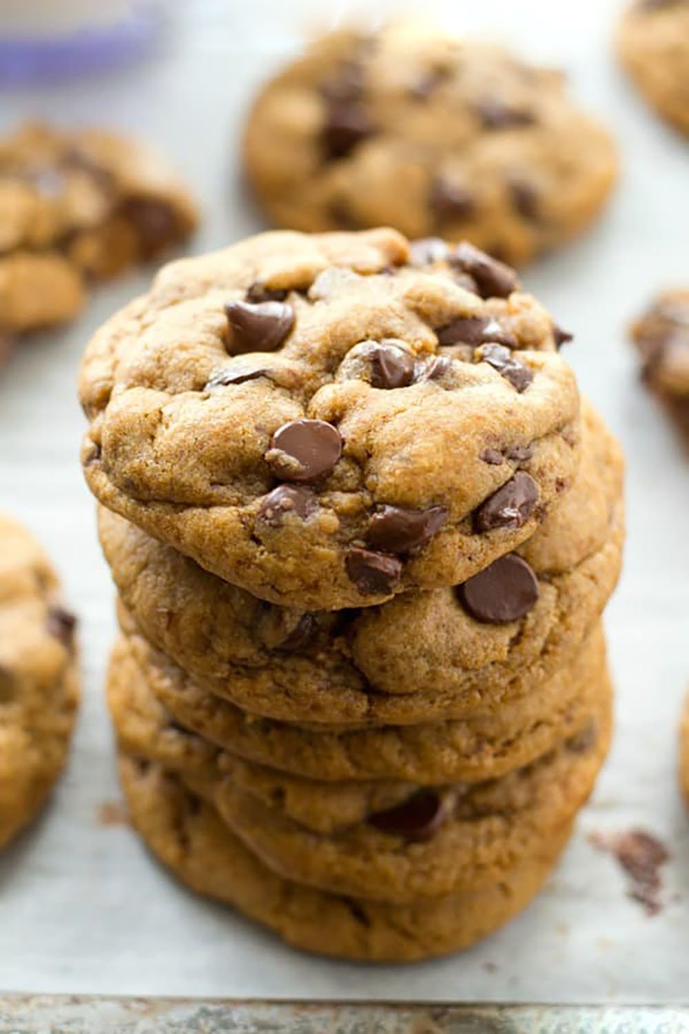These coconut oil chocolate chip cookies are perfectly crispy on the outside and so soft and chewy inside, you'll never guess that they're made healthy with coconut oil and contain NO butter! Destined to become your new favorite chocolate chip cookie.
