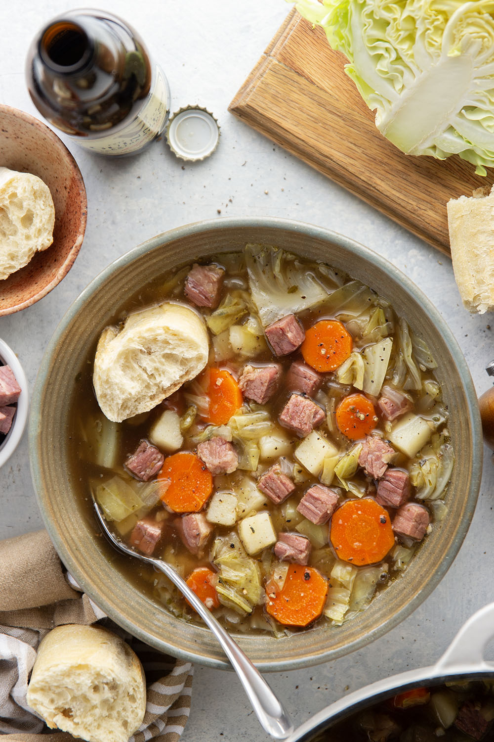 This corned beef cabbage soup features leftover corned beef, tender cabbage, and other hearty root vegetables simmered in a flavorful stout beer and beef broth.