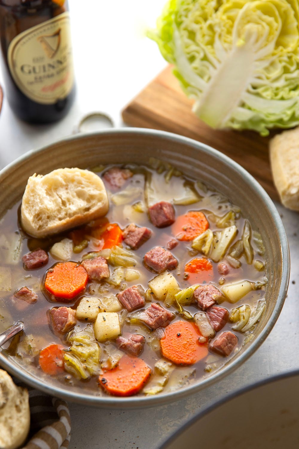 This corned beef cabbage soup features leftover corned beef, tender cabbage, and other hearty root vegetables simmered in a flavorful stout beer and beef broth.