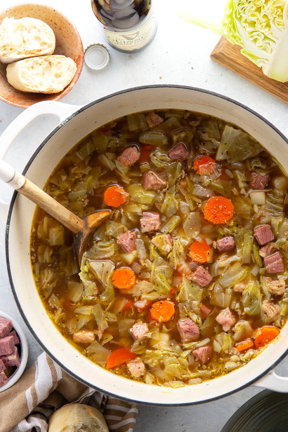 This corned beef cabbage soup features leftover corned beef, tender cabbage, and other hearty root vegetables simmered in a flavorful stout beer and beef broth.