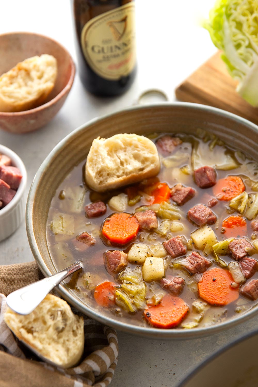 This corned beef cabbage soup features leftover corned beef, tender cabbage, and other hearty root vegetables simmered in a flavorful stout beer and beef broth.