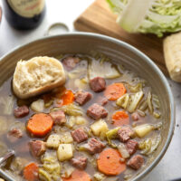 This corned beef cabbage soup features leftover corned beef, tender cabbage, and other hearty root vegetables simmered in a flavorful stout beer and beef broth.