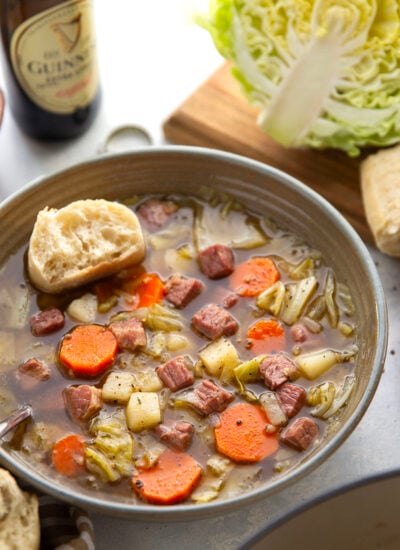 This corned beef cabbage soup features leftover corned beef, tender cabbage, and other hearty root vegetables simmered in a flavorful stout beer and beef broth.