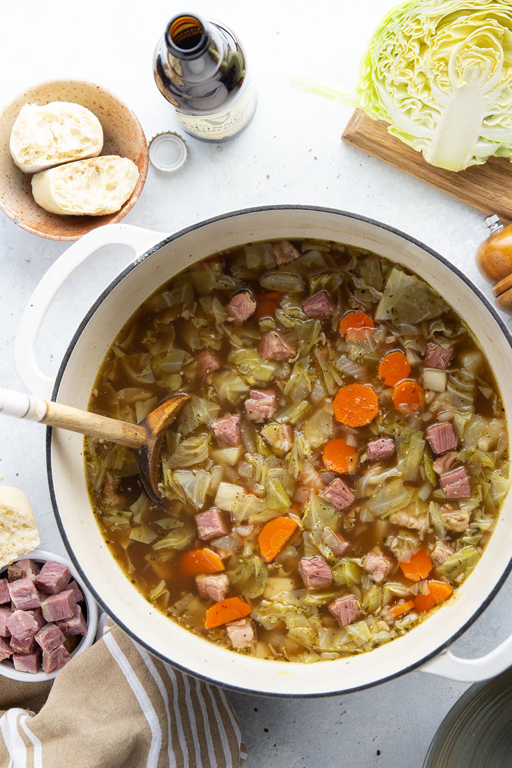 This corned beef cabbage soup features leftover corned beef, tender cabbage, and other hearty root vegetables simmered in a flavorful stout beer and beef broth.