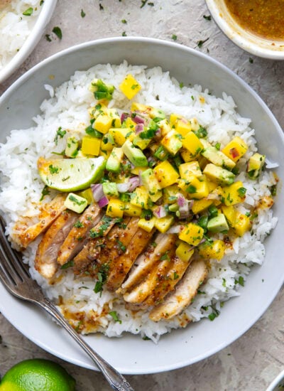 These honey mustard chicken bowls are loaded with so much goodness and you won't believe how quickly they come together! Sweet and tangy honey mustard chicken thighs pair perfectly with fluffy rice and a fresh mango salsa.