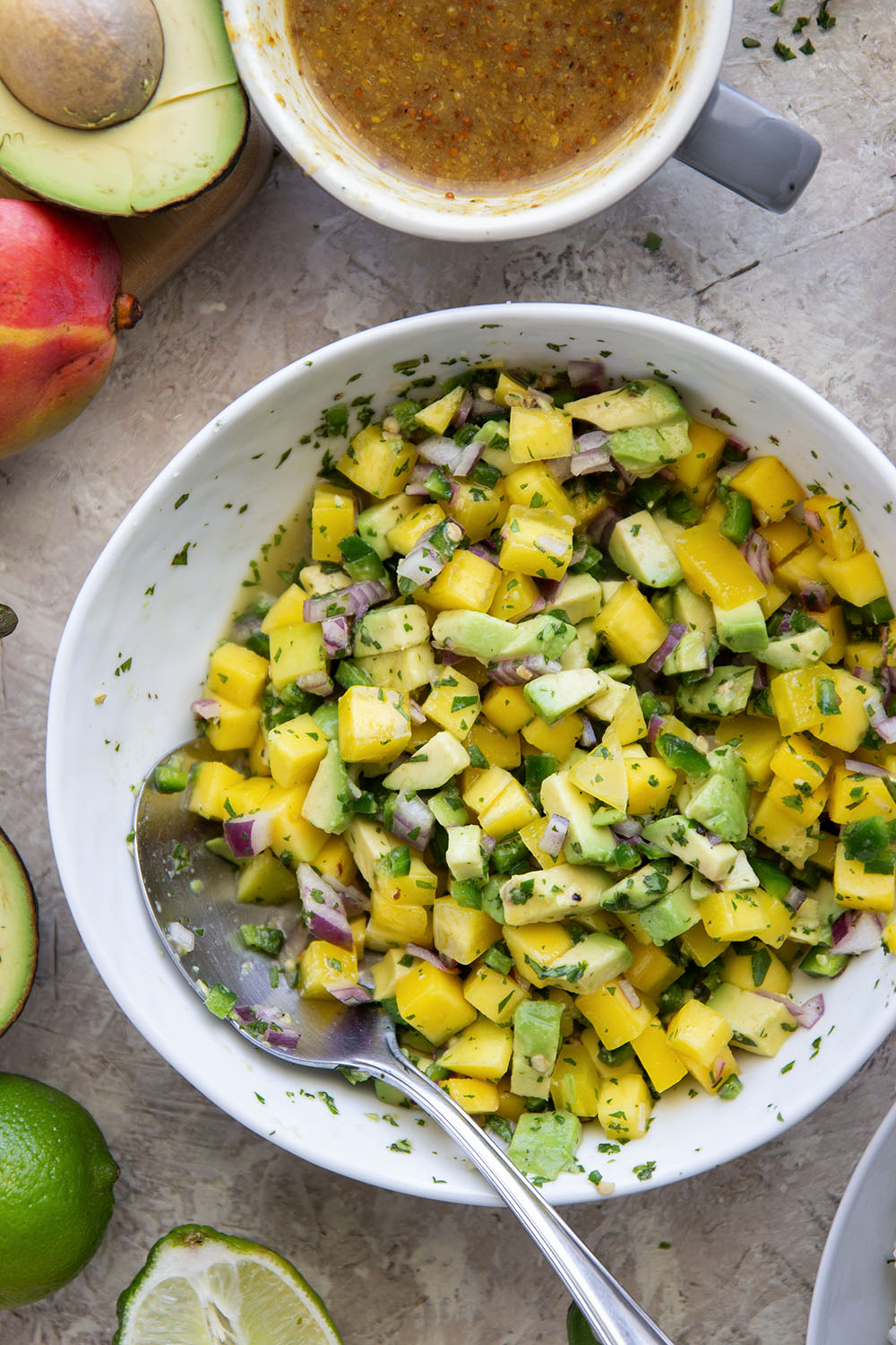 These honey mustard chicken bowls are loaded with so much goodness and you won't believe how quickly they come together! Sweet and tangy honey mustard chicken thighs pair perfectly with fluffy rice and a fresh mango salsa.
