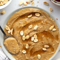You'll never go back to jarred peanut butter after one taste of this smooth, creamy homemade maple peanut butter, that's lightly flavored with maple syrup, vanilla, and a touch of cinnamon.