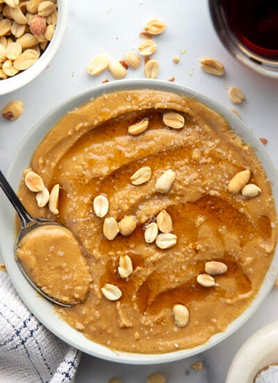 You'll never go back to jarred peanut butter after one taste of this smooth, creamy homemade maple peanut butter, that's lightly flavored with maple syrup, vanilla, and a touch of cinnamon.