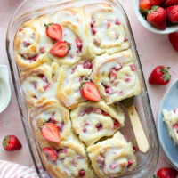 Melt-in-your-mouth fluffy sweet rolls are stuffed with a sweet and tangy rhubarb strawberry filling for the ultimate twist on strawberry sweet rolls!