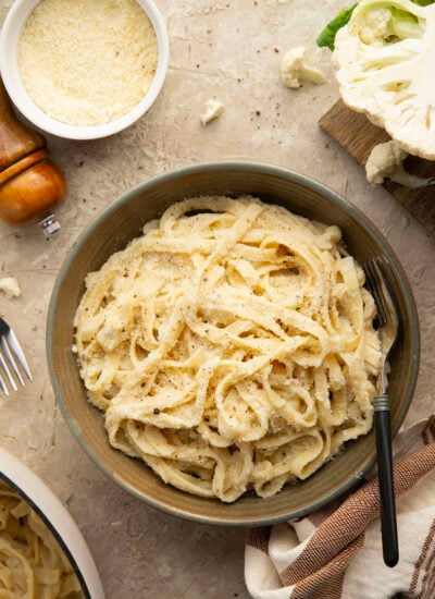 Indulge in a creamy, silky alfredo sauce for a fraction of the calories in this cauliflower alfredo sauce version! NO heavy cream needed and it's made in minutes on the stovetop.