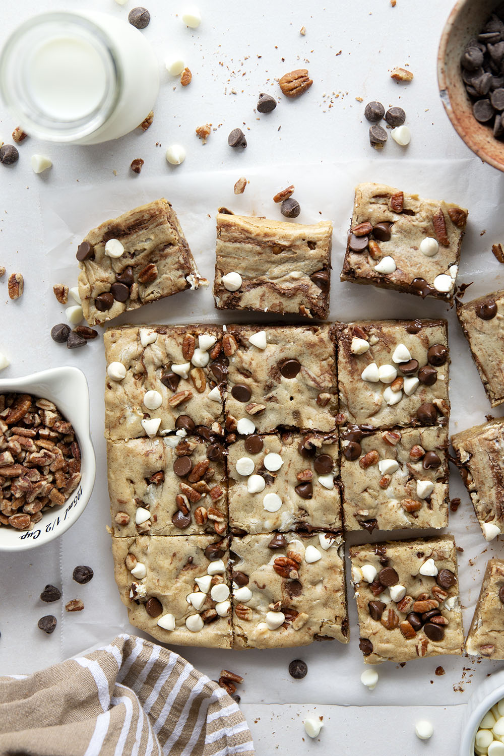 Loaded with two kinds of chocolate and lots of toasted nuts, these soft and chewy chocolate chip blondies truly are the ultimate! You won't believe how easy they are to make.