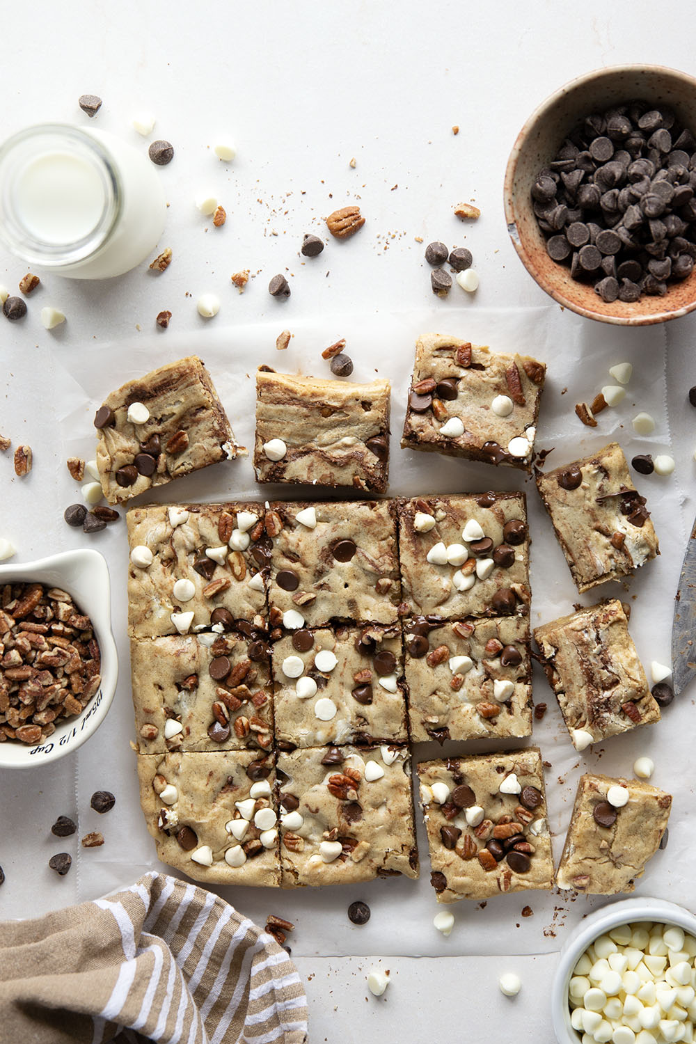 Loaded with two kinds of chocolate and lots of toasted nuts, these soft and chewy chocolate chip blondies truly are the ultimate! You won't believe how easy they are to make.