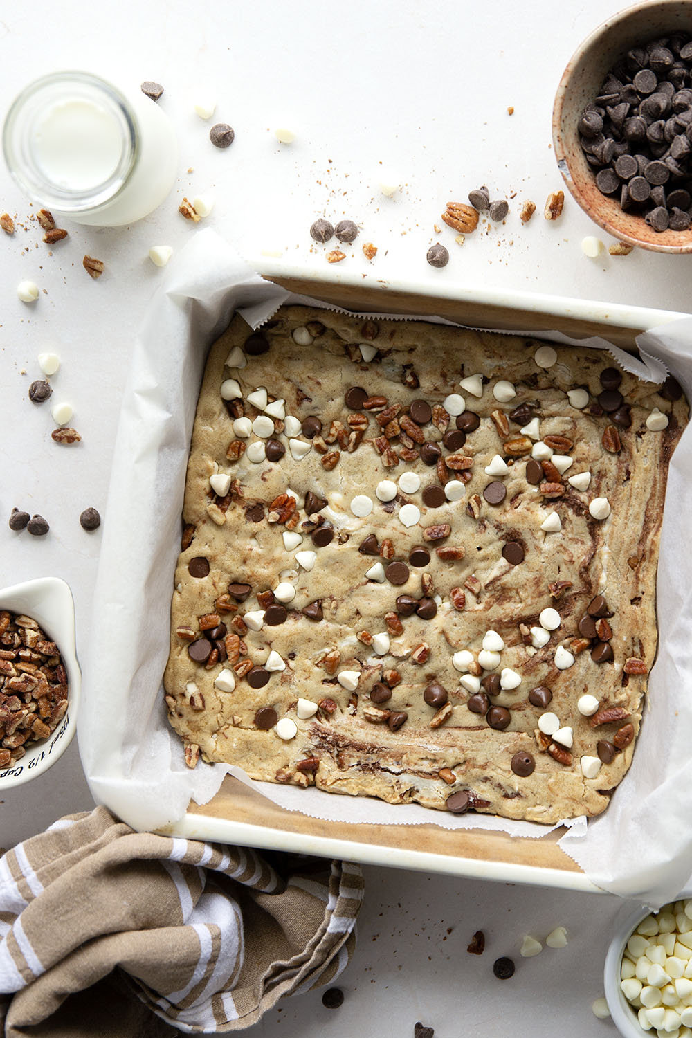 Loaded with two kinds of chocolate and lots of toasted nuts, these soft and chewy chocolate chip blondies truly are the ultimate! You won't believe how easy they are to make.