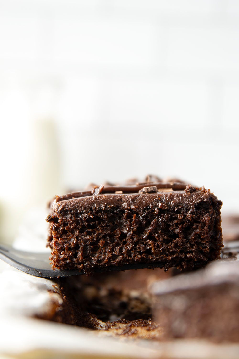 This classic chocolate sheet cake is always a hit at parties! Supremely moist, heavy on the chocolate, and frosted in a silky chocolate fudge frosting.