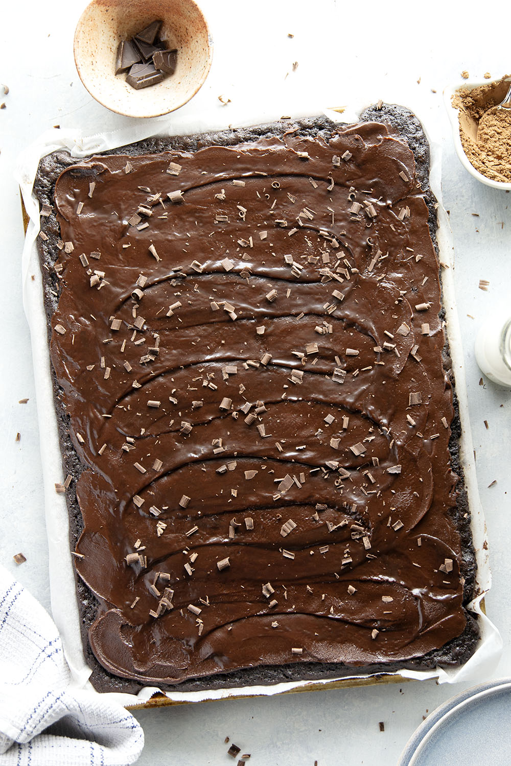 This classic chocolate sheet cake is always a hit at parties! Supremely moist, heavy on the chocolate, and frosted in a silky chocolate fudge frosting.