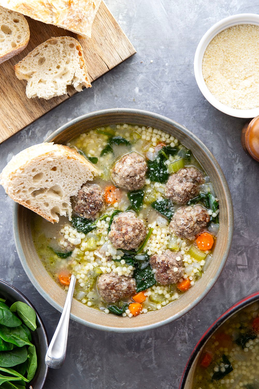 This hearty Italian wedding soup is packed full of juicy Italian sausage meatballs, tender pasta, and lots of veggies in a rich broth. Top bowls with lots of Parmesan and serve with thick bread slices for dipping.